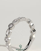 Kynora CJ round marquise bezel set wedding ring with elegant design, showcasing sparkling marquise-cut diamonds on a sleek band.