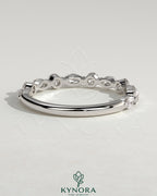 Kynora CJ round marquise wedding band with shared prong accent stones, sleek and elegant jewelry for special occasions.
