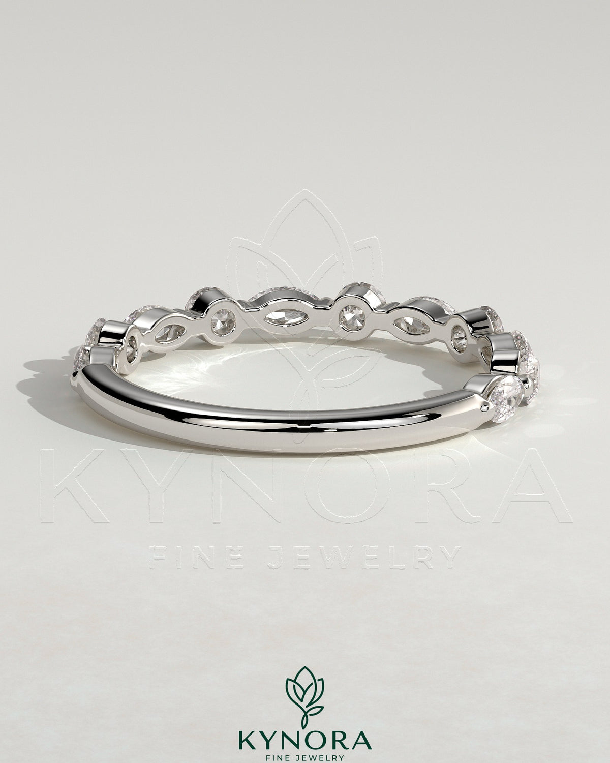 Kynora CJ round marquise wedding band with shared prong accent stones, sleek and elegant jewelry for special occasions.