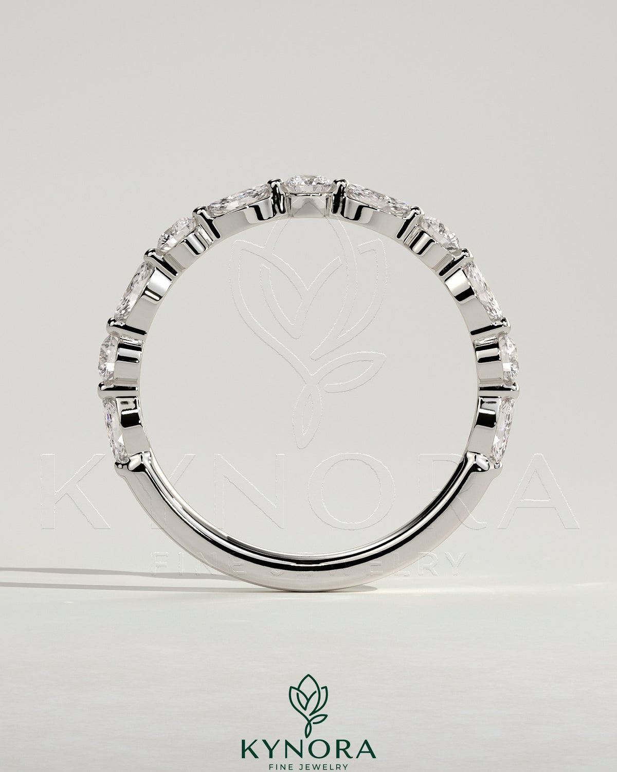 Kynora CJ round marquise wedding band with shared prong accent stones, elegant and sparkling jewelry for special occasions.