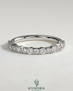 Kynora CJ round mixed size accent stone wedding band featuring multiple small stones, elegant and sparkling for special occasions.