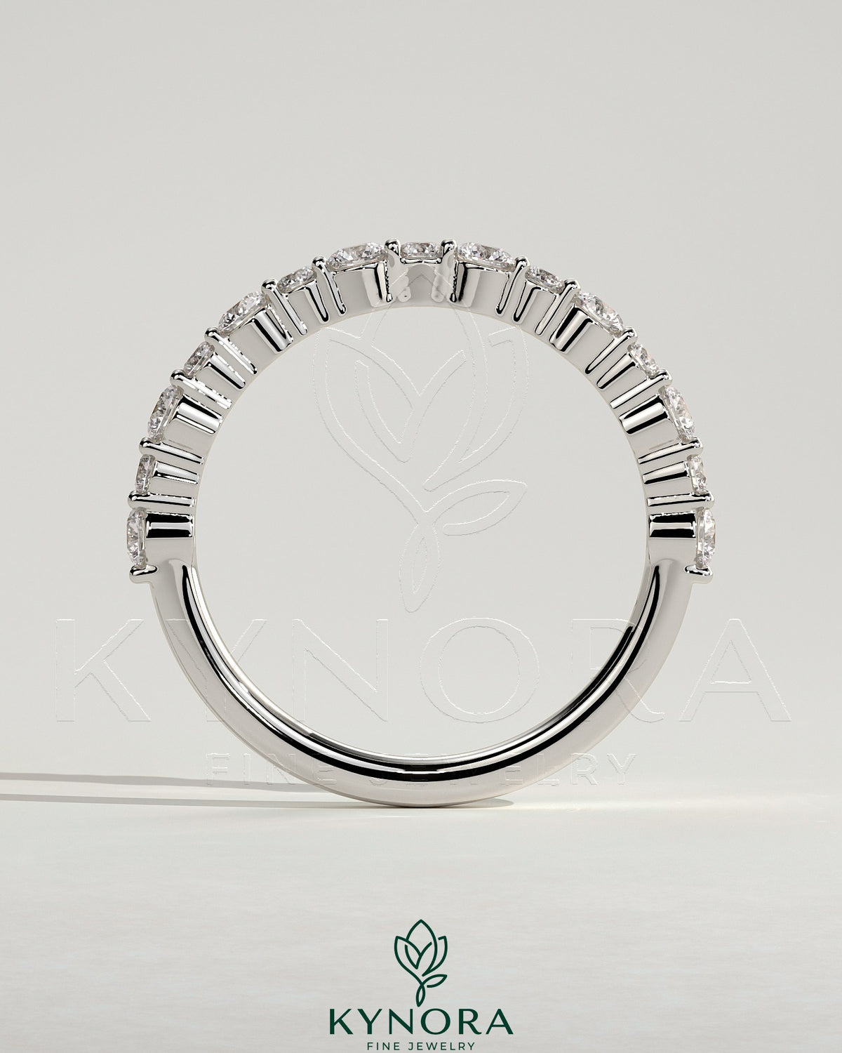 Kynora CJ round wedding band with mixed size accent stones, elegant jewelry for special occasions.