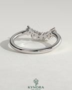 Kynora CJ round accent stone wedding band with a curved design and sparkling stones, elegant jewelry for special occasions