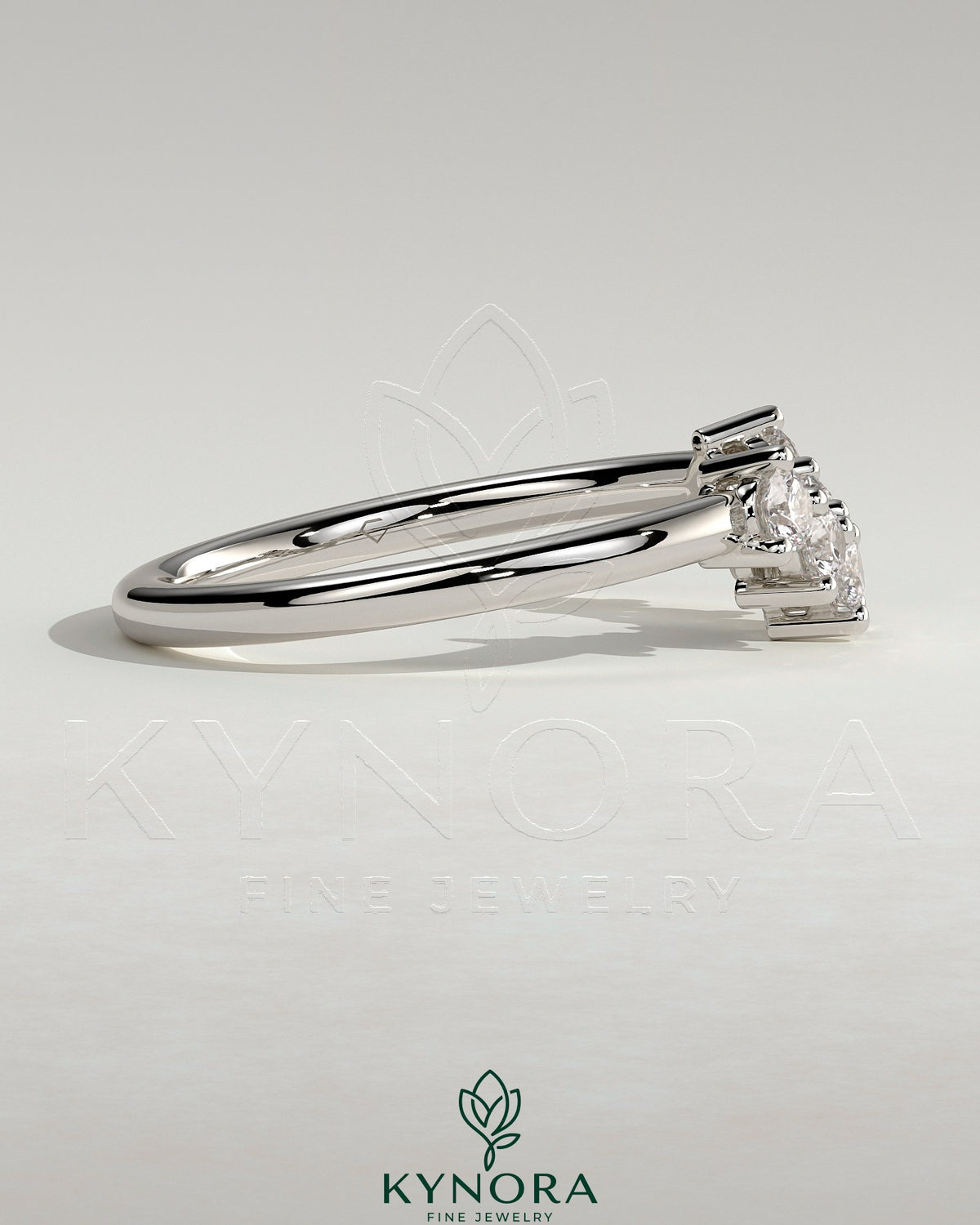 Kynora CJ round accent wedding band with curved design and embedded accent stones, elegant and polished jewelry for special occasions.