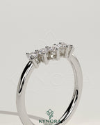Kynora CJ round wedding band with accent stones and a curved design, elegant gold wedding ring for special occasions.