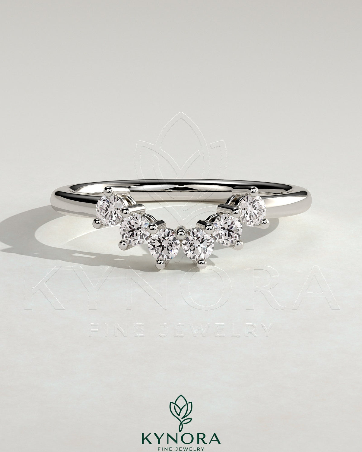 Kynora CJ round accent wedding band with curved design and sparkling stones on polished gold band for elegant bridal jewelry