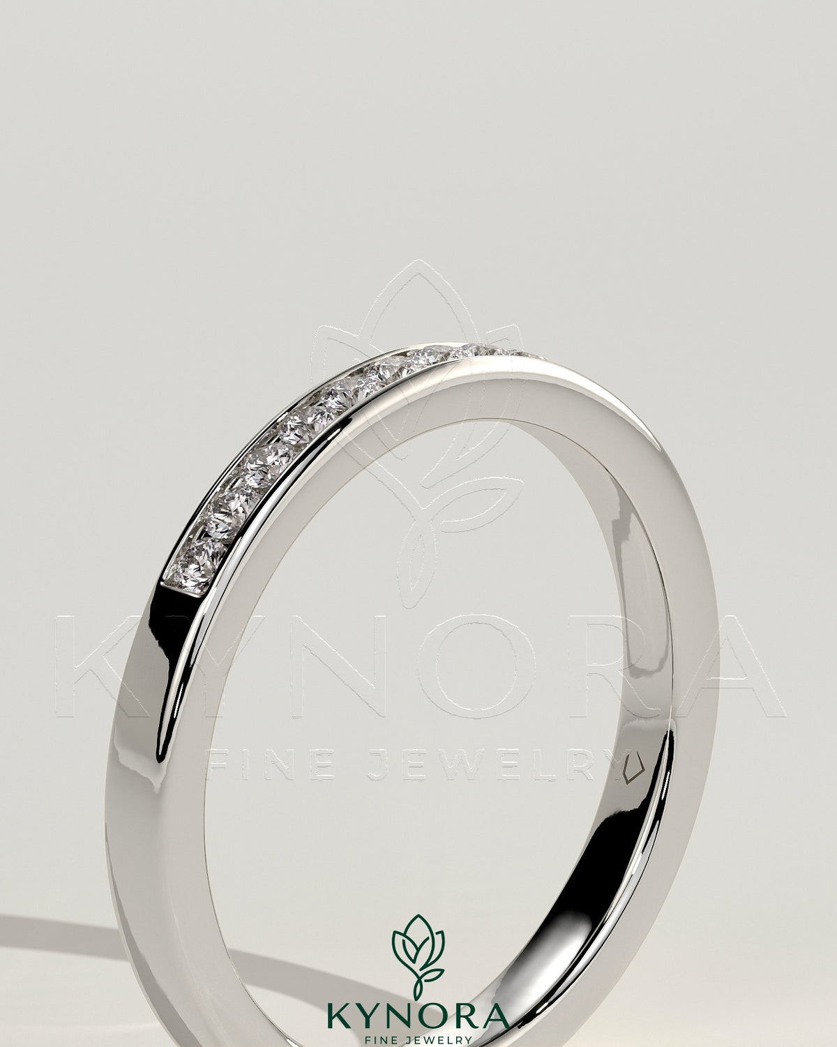 Kynora CJ round channel set wedding band with smooth polished finish, designed for elegant bridal jewelry.