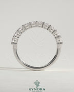 Kynora CJ round eternity wedding band ring with a continuous row of sparkling gemstones, crafted for elegant wedding jewelry.