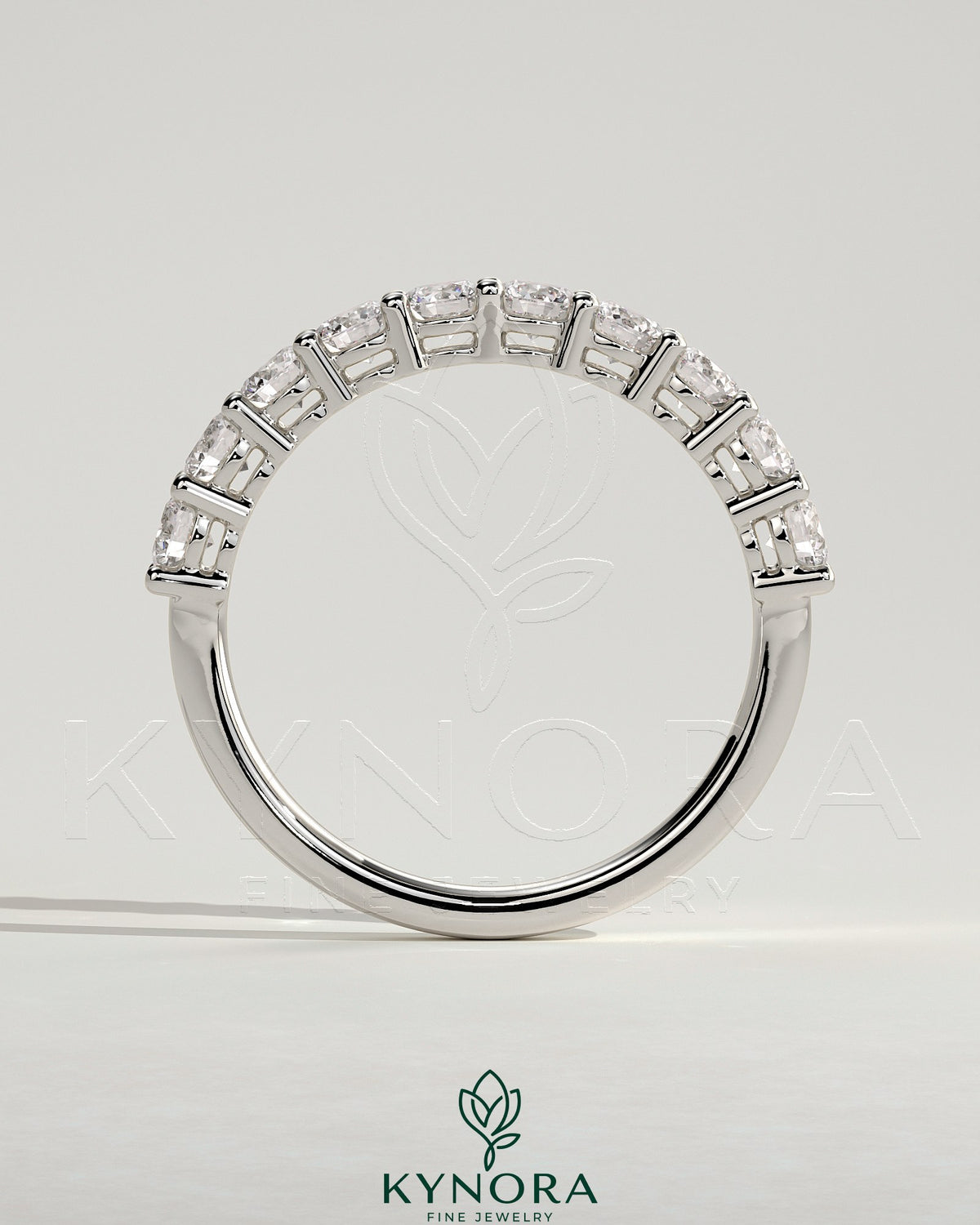 Kynora CJ round eternity wedding band ring with a continuous row of sparkling gemstones, crafted for elegant wedding jewelry.