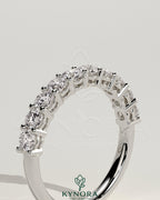 Round eternity wedding band by Kynora CJ, featuring a continuous circle of sparkling gemstones for elegant wedding jewelry.
