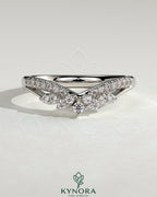 Kynora CJ studded titanium curved wedding band with pave setting, featuring a sleek, modern design for elegant bridal jewelry.
