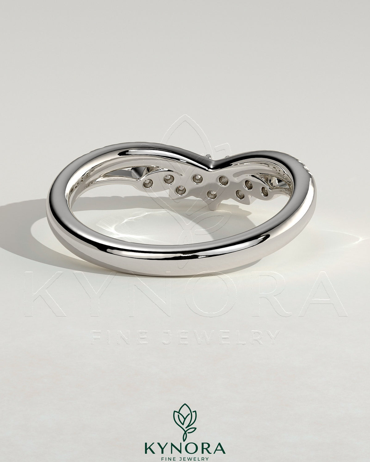 Kynora CJ studded tiara curved wedding band with pave setting, featuring sparkling stones and elegant design.