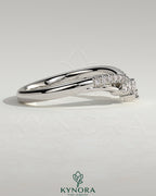 Kynora CJ studded tiara-shaped curved wedding band with pave-set stones, elegant jewelry designed for special occasions.