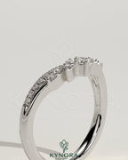 Kynora CJ studded curved wedding band with pave setting, featuring small sparkling stones and a sleek, elegant design.