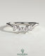 Kynora CJ Trillion Trillion accent stone wedding band with a curved design, featuring sparkling accent stones on a elegant gold band.