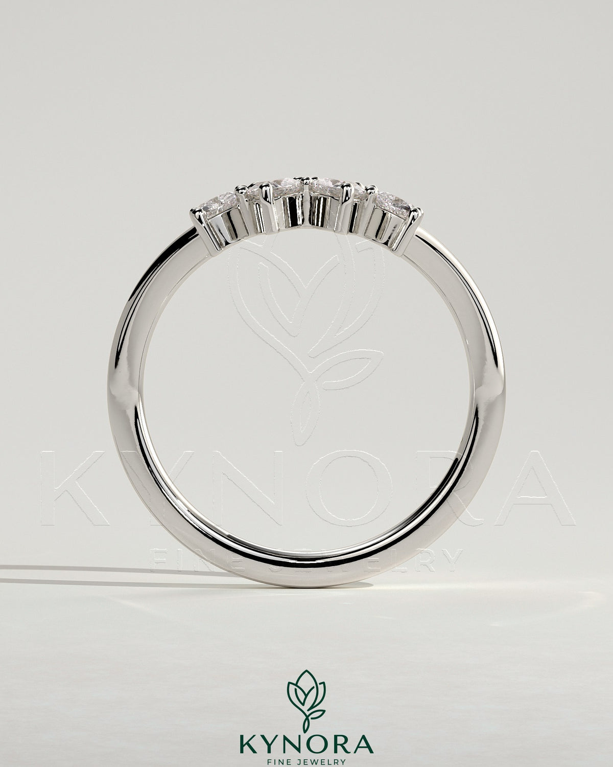 Kynora CJ Trillion Accent Stone wedding band with curved design, featuring sparkling accent stones on a polished metal band.