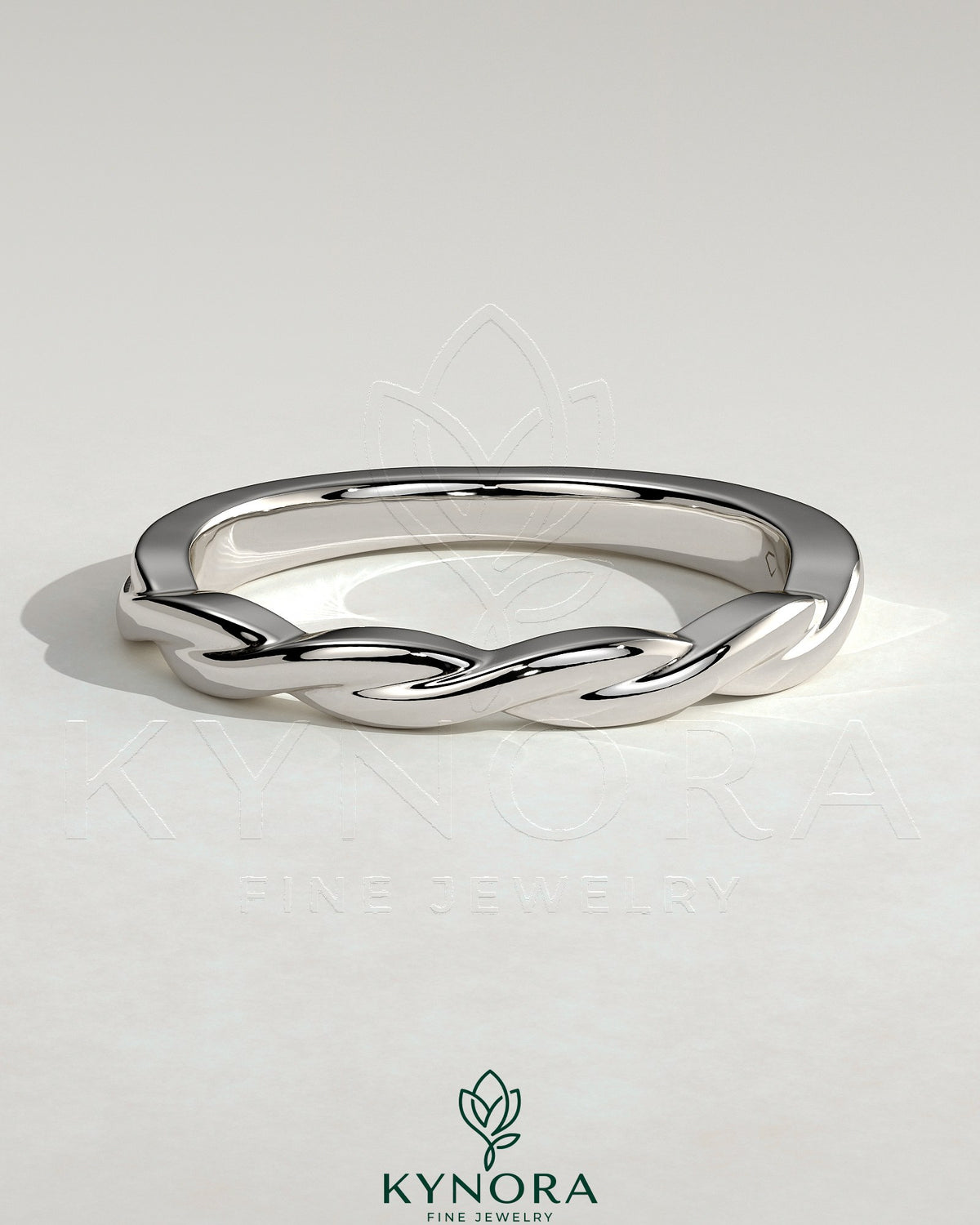 Kynora CJ twisted band wedding ring with elegant intertwined design, crafted in high-quality metal for special occasions. Imagen principal del producto