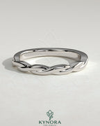 Kynora CJ twisted band wedding ring with elegant intertwined design, crafted in high-quality metal for special occasions.
