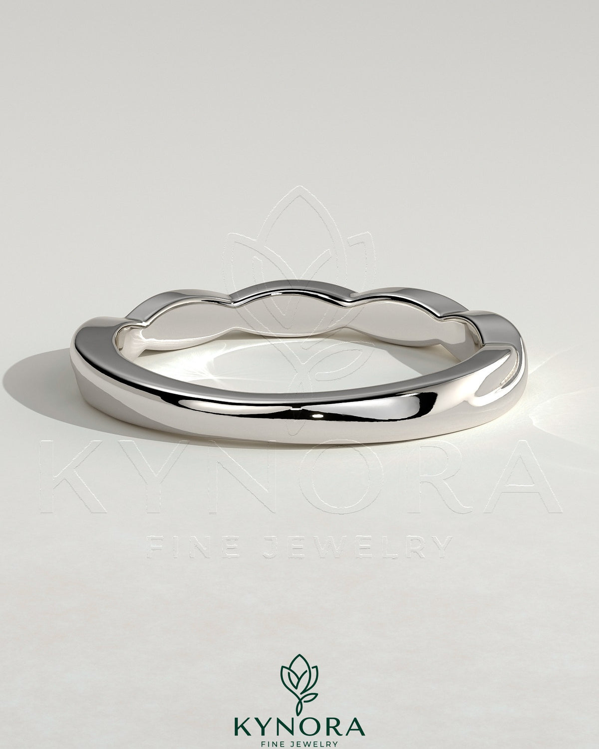 Elegant twisted band wedding ring by Kynora CJ featuring a sleek, intertwined design in polished metal.