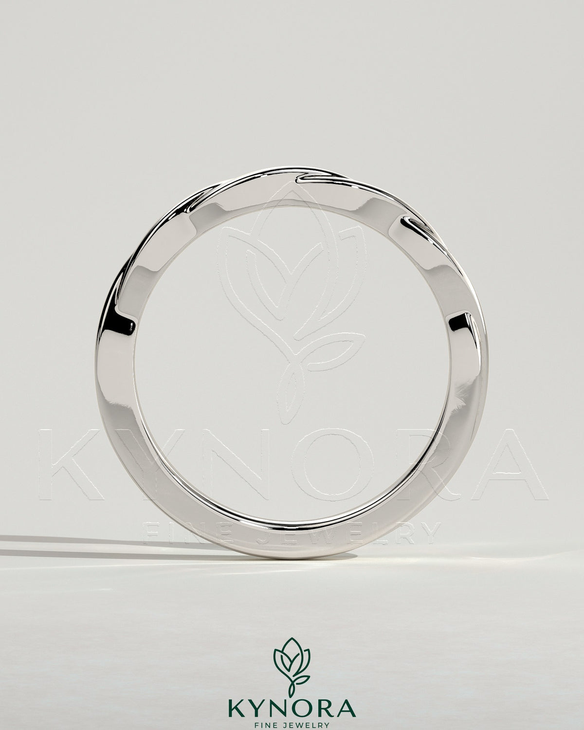 Twisted band wedding ring by Kynora CJ featuring a sleek, intertwined design in polished metal, ideal for wedding jewelry.