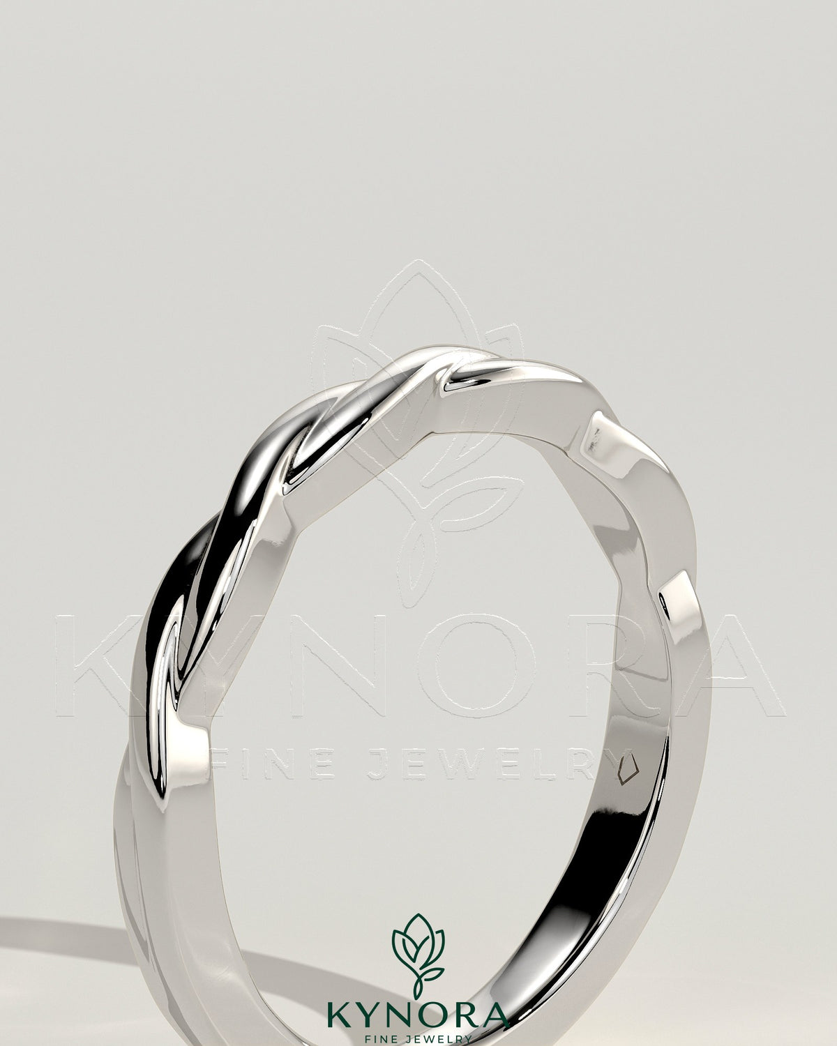Twisted band wedding ring by Kynora CJ featuring a sleek, elegant design in polished metal for special occasions.