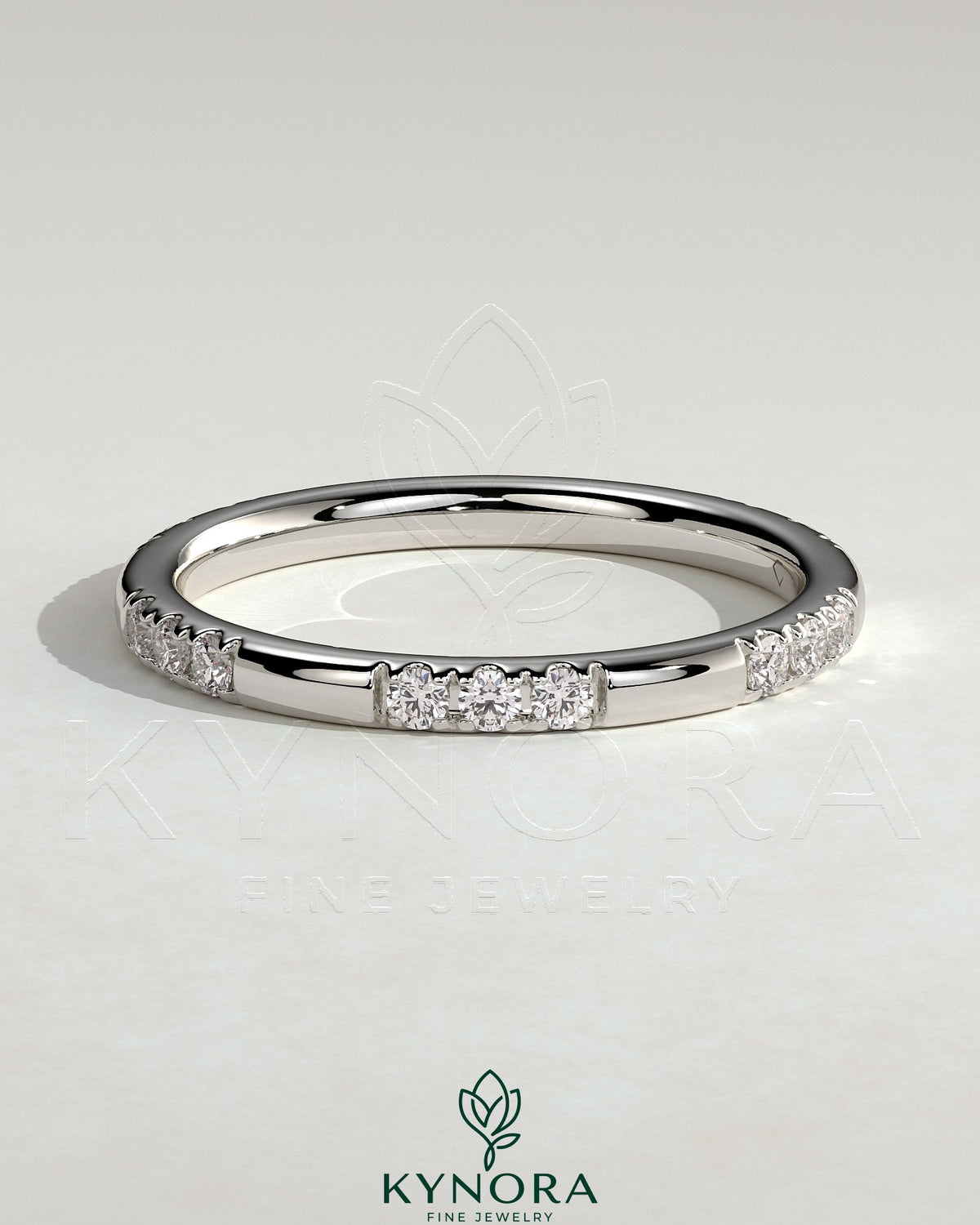 Two third spaced clustered pave diamond wedding band by Kynora CJ, showcasing sparkling pave setting on a sleek gold band. Main image