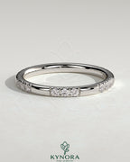 Two third spaced clustered pave diamond wedding band by Kynora CJ, showcasing sparkling pave setting on a sleek gold band.