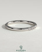 Two third spaced clustered pave wedding band ring by Kynora CJ with intricate diamond detailing and elegant design.