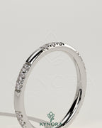 Two third spaced clustered pave band wedding ring by Kynora CJ with intricate pave detailing on shiny gold band