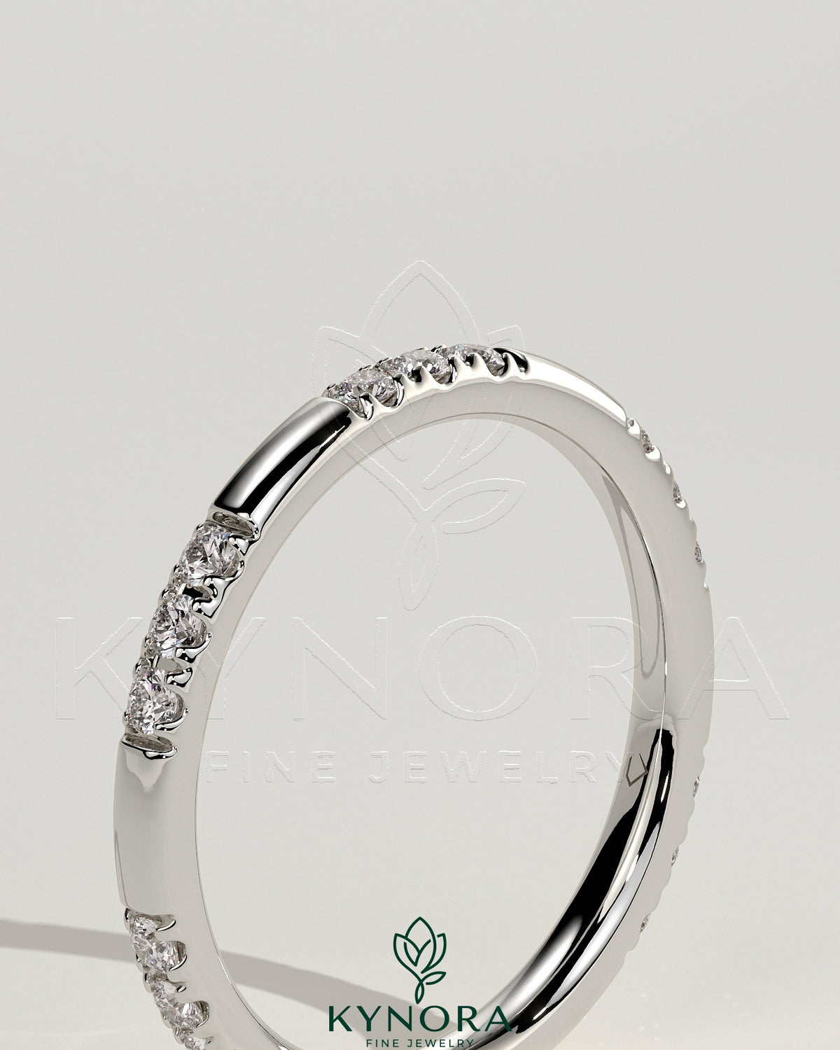 Two third spaced clustered pave band wedding ring by Kynora CJ with intricate pave detailing on shiny gold band