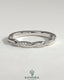 Kynora CJ twisted band wedding ring with pave detailing, elegant two-third design, showcasing intricate craftsmanship and sparkling accents.