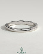 Kynora CJ Two Third Twisted Band wedding ring with pave accents, showcasing intricate design and sparkling details.