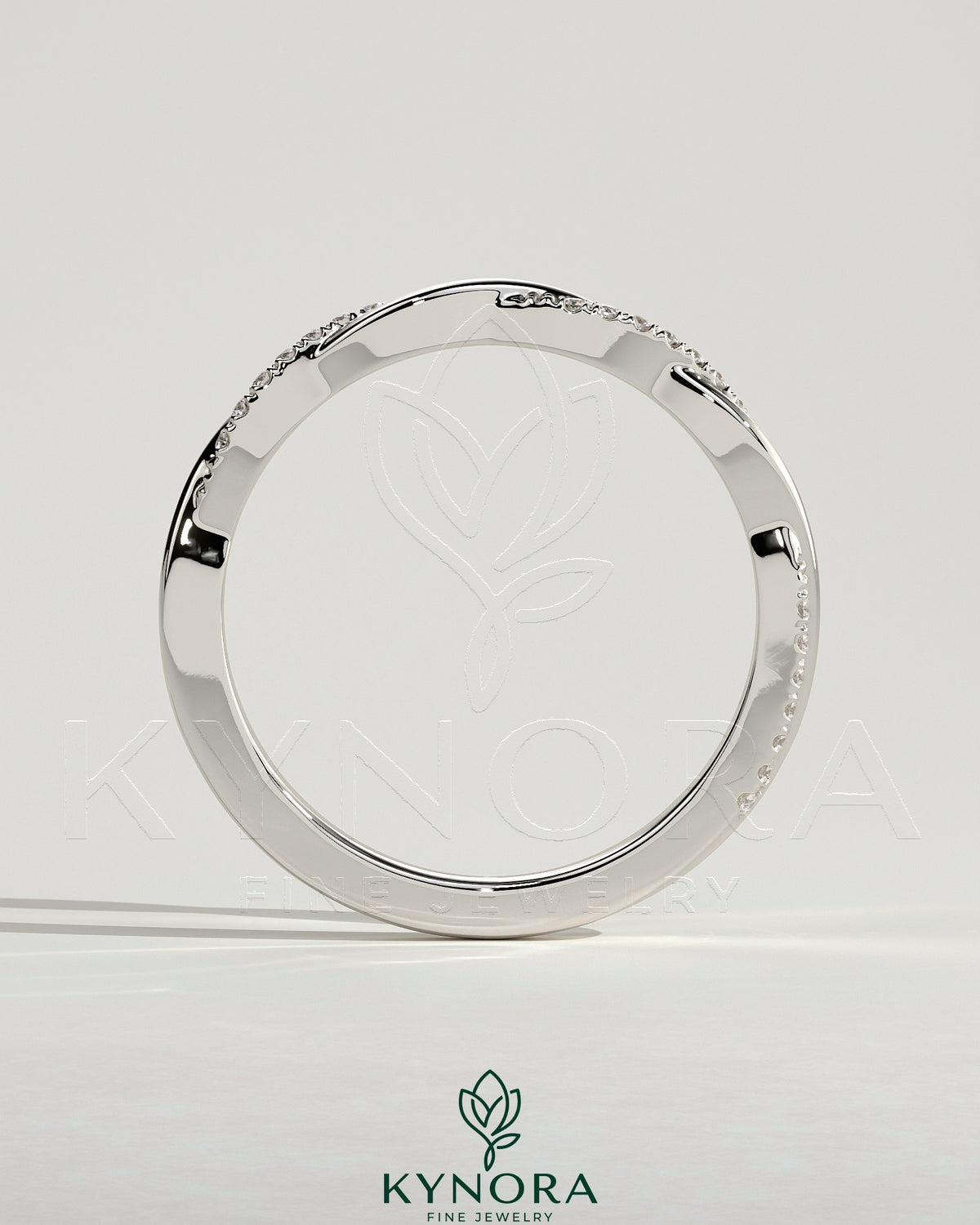 Kynora CJ Two Third Twisted Band wedding ring with pave accents, showcasing intricate design and sparkling detail.