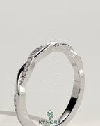Kynora CJ two-third twisted band wedding ring with pave accents, showcasing intricate design and sparkling detail.