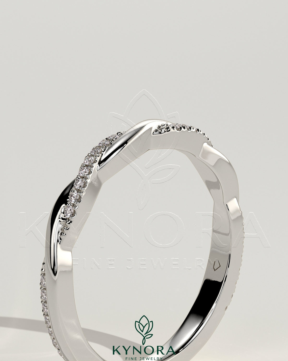 Kynora CJ two-third twisted band wedding ring with pave accents, showcasing intricate design and sparkling detail.