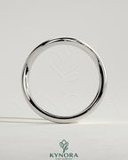 Elegant Kynora CJ Wave Band wedding ring with sleek design and polished finish, showcasing its modern style and craftsmanship.