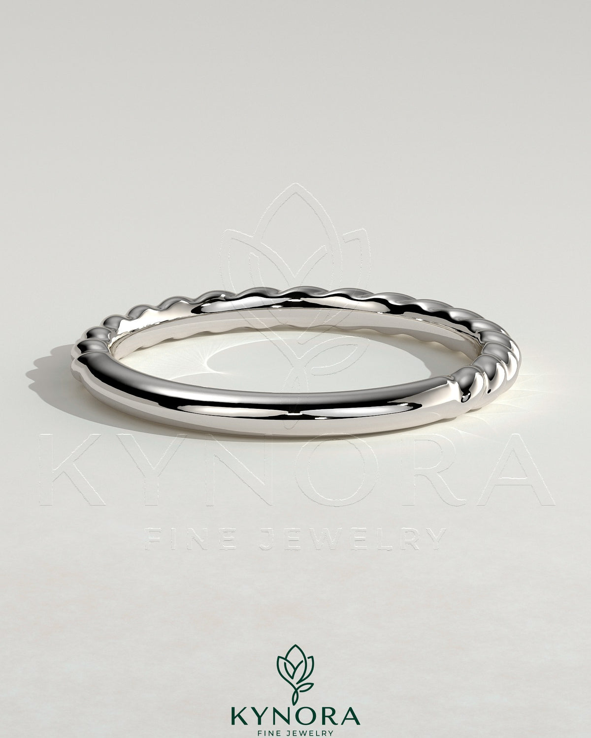 Elegant woven band wedding ring by Kynora CJ, showcasing intricate craftsmanship and a polished finish on a sleek gold band.