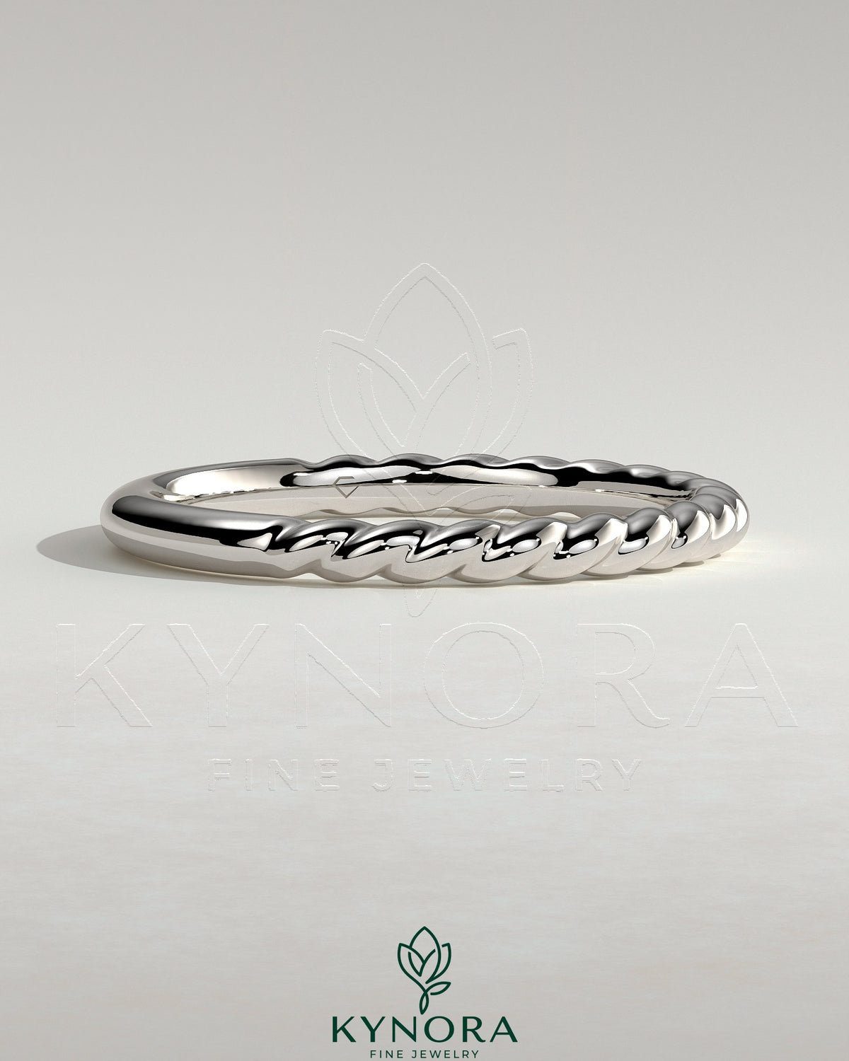 Kynora CJ woven band wedding ring with intricate woven design, made of polished metal, showcasing elegant craftsmanship.