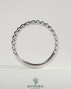 Kynora CJ woven band wedding ring with intricate woven design in silver, showcasing craftsmanship for special occasions.