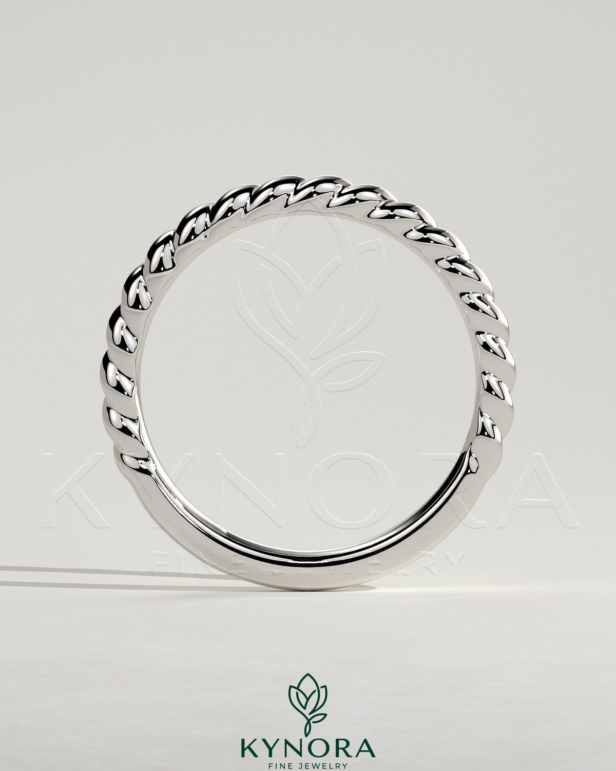 Kynora CJ woven band wedding ring with intricate woven design in silver, showcasing craftsmanship for special occasions.