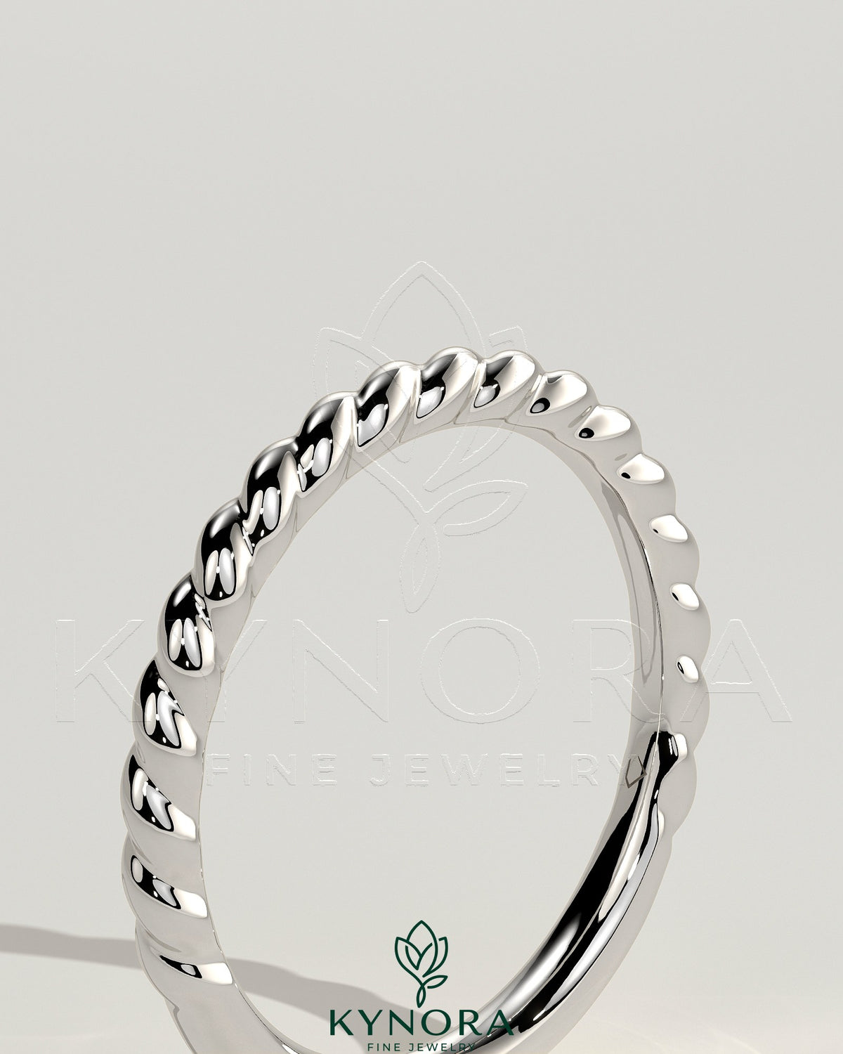 Kynora CJ woven band wedding ring with intricate woven design in silver-tone metal, elegant and suitable for special occasions.