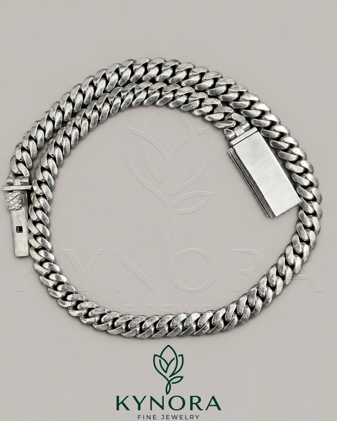 10 mm plain Cuban link chain necklace in 10K white gold, hip hop style, featuring a sleek, polished design from Kynora Jewels.