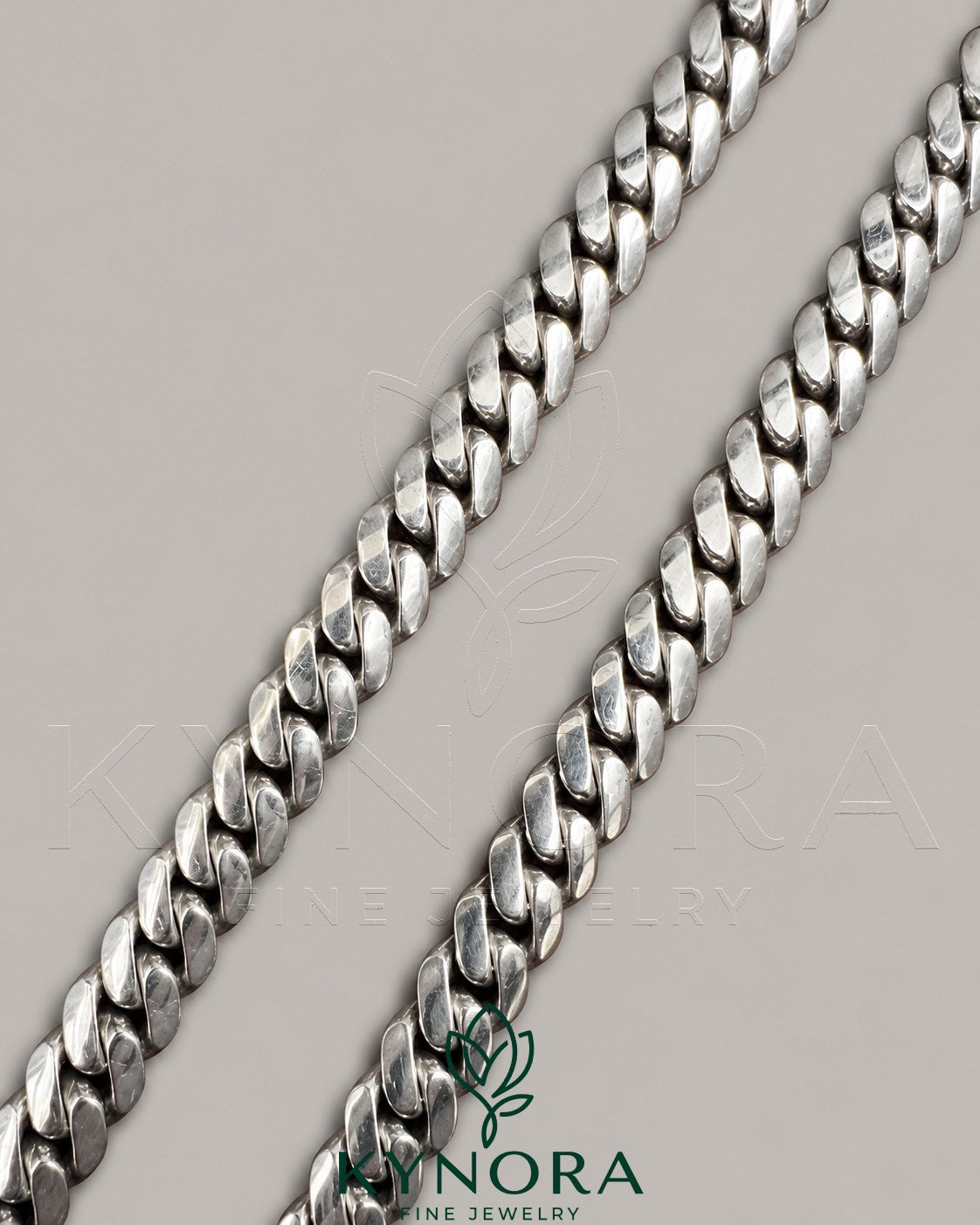 10mm plain Cuban link chain necklace in 10K white gold, hiphop style by Kynora Jewels, showcasing a sleek, polished jewelry piece