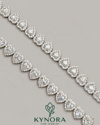 Kynora Jewels 10mm moissanite diamond heart-shaped silver tennis link chain, hip-hop style jewelry, shiny and detailed.