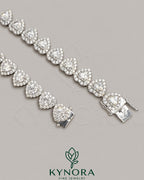 Heart-shaped 10mm moissanite diamond hip-hop chain in 925 silver with tennis link style, by Kynora Jewels.