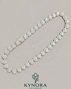 Heart-shaped moissanite diamond hiphop chain in 10mm silver tennis link, featuring Kynora Jewels branding.