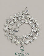 Heart-shaped 10mm moissanite diamond hip hop chain in 925 silver featuring tennis link design from Kynora Jewels.