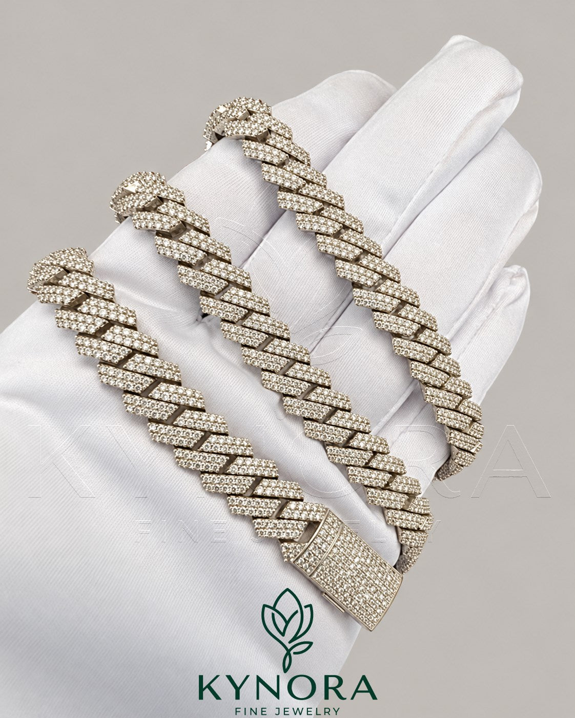 Sterling silver VVS moissanite Cuban link chain, 10mm hip-hop style jewelry from Kynora Jewels with sparkling gemstone accents.