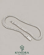 Sterling silver Cuban link chain with 10mm VVS moissanite stones, hip-hop style jewelry by Kynora Jewels