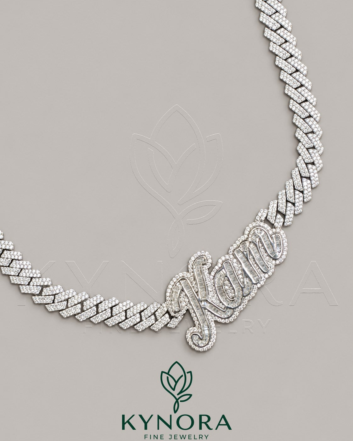 Sterling silver Cuban link chain with 10mm VVS Moissanite diamonds and customized name pendant, hip-hop style jewelry by Kynora Jewels.